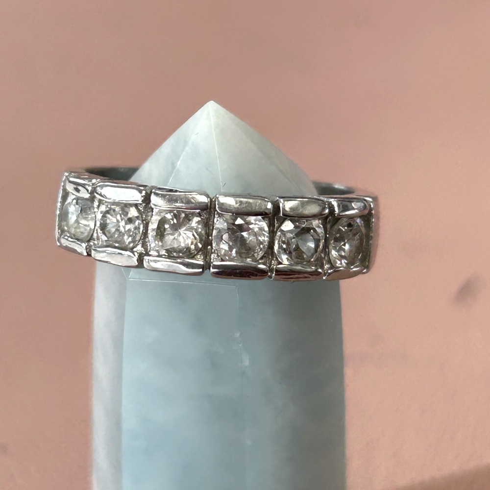 Silver plated ring round CZ  1/2 way around the ring  size 8.5